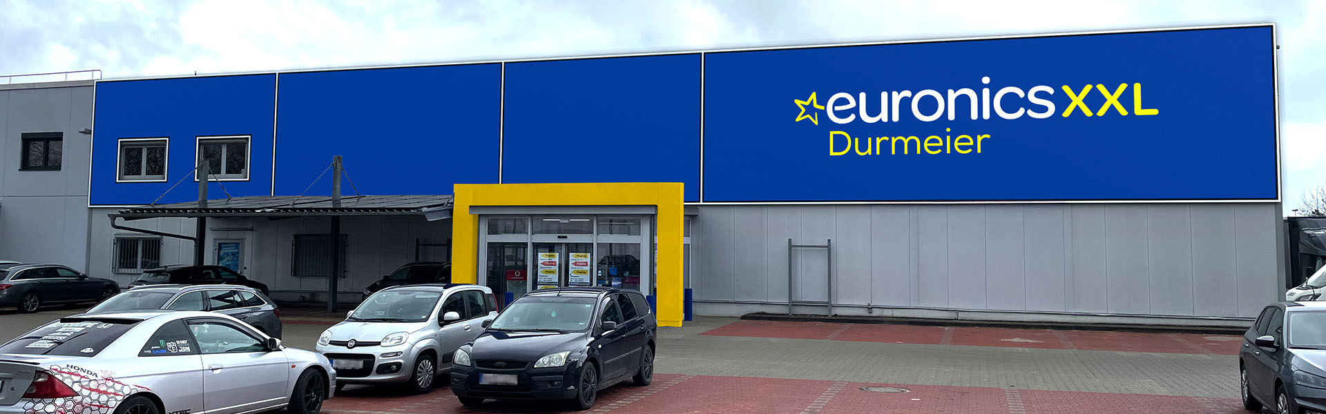 visualisierung-simulation-fassadenbranding-euronics-durmeier-eingang-1920px-600px